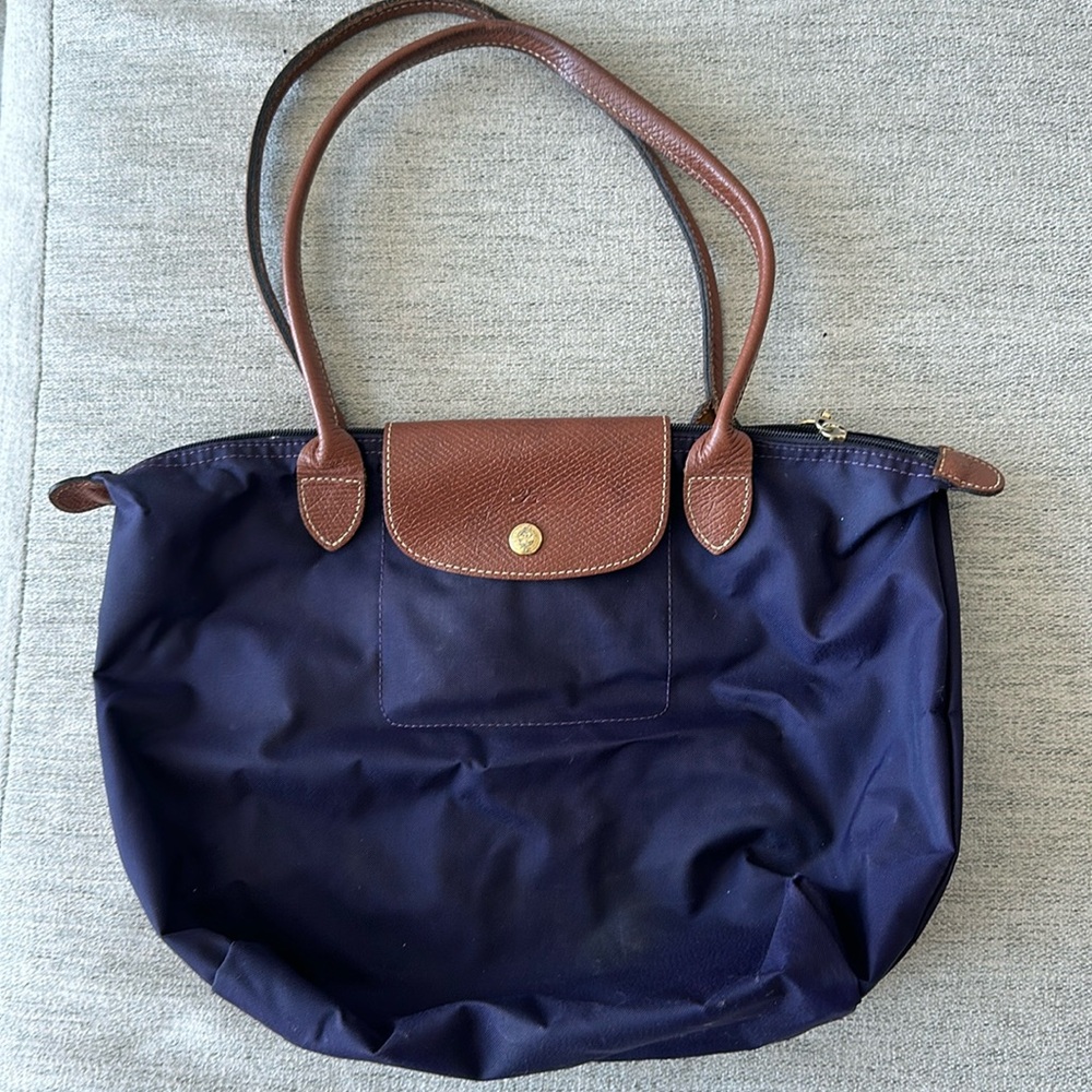 Used purple longchamp medium size purse